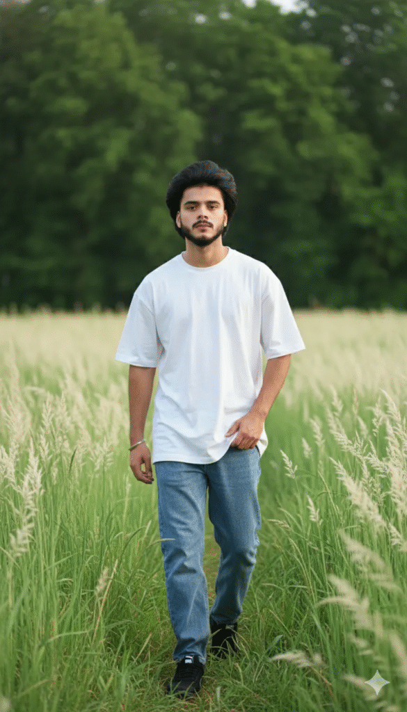 Thoughtful Stroll in an Oversized White Tee and Lush Field